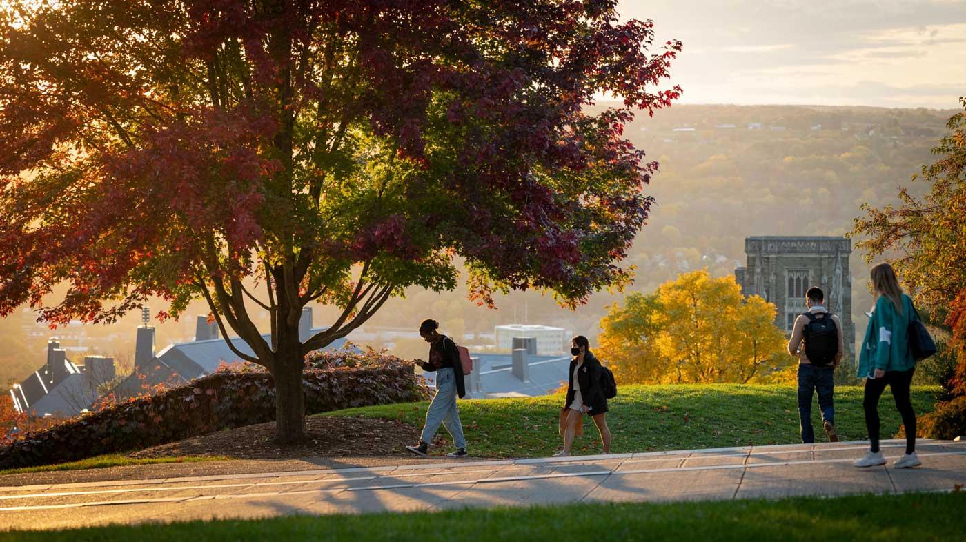 Students walking outside during autumn