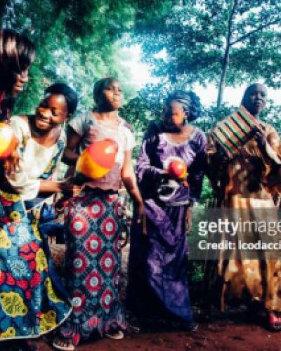 African Culture, women dancing in colorful dress