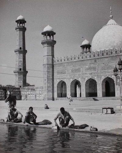 Muslims taking water from pool
