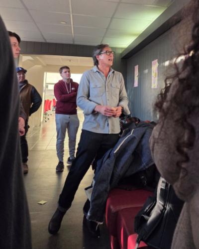 Derek Chang reads trivia questions about Spring semester courses. 